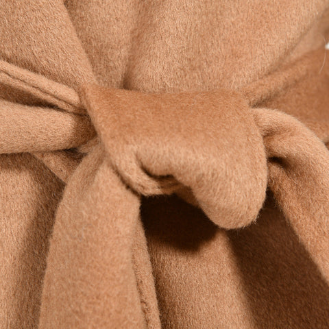 Close up from a camel cashmere coat for woman. 